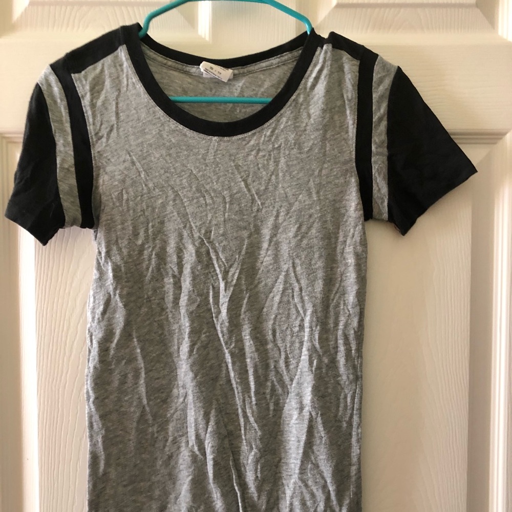 grey shirt with black detailing